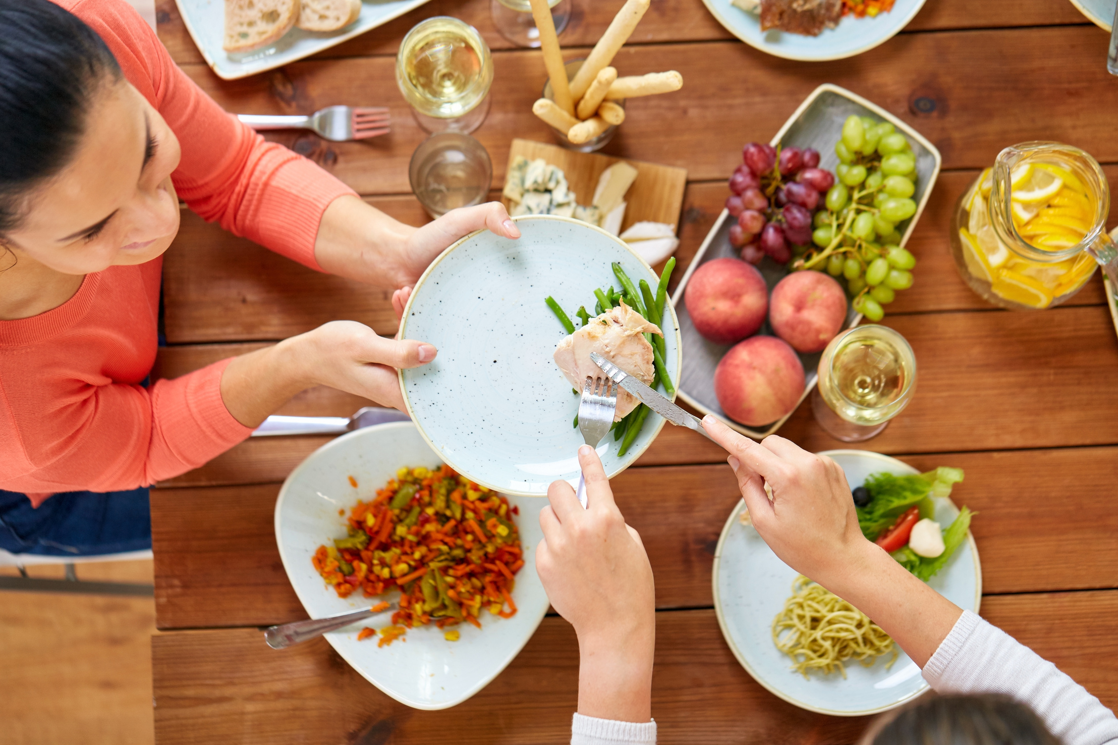 Women Eating Chicken for Dinner